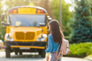 student waiting for the school bus