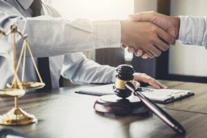attorney outside expert shaking hands