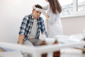 head injury being treated by a doctor