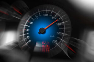 A car speedometer shows a speed of about 140 km/h with a blurred effect suggesting motion—considered reckless driving; the digital display below reads 152.3 and 71573.